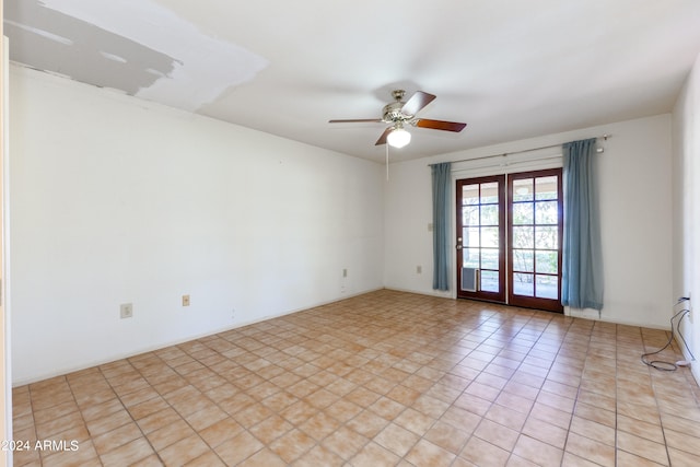 spare room with ceiling fan, light tile flooring, and french doors