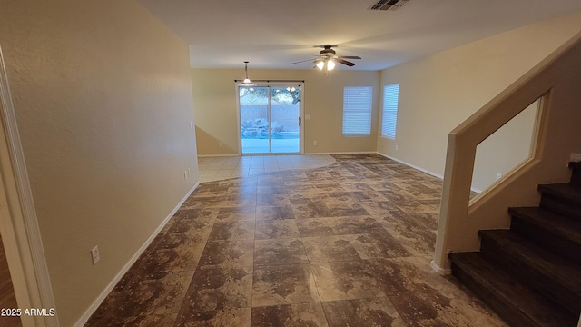 unfurnished room featuring ceiling fan