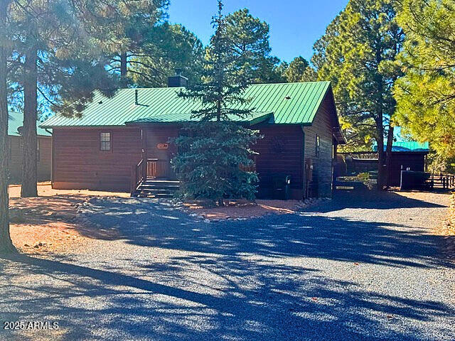 exterior space with metal roof and a standing seam roof