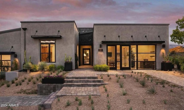 exterior space featuring stucco siding