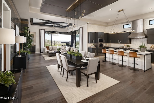 dining space with dark wood finished floors and recessed lighting