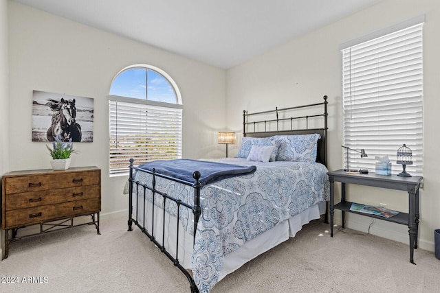 bedroom with light colored carpet