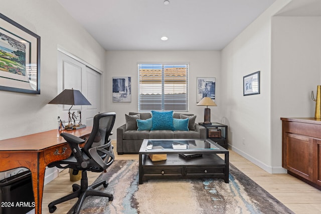 office with light hardwood / wood-style floors