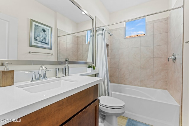 full bathroom featuring shower / bath combo with shower curtain, vanity, and toilet