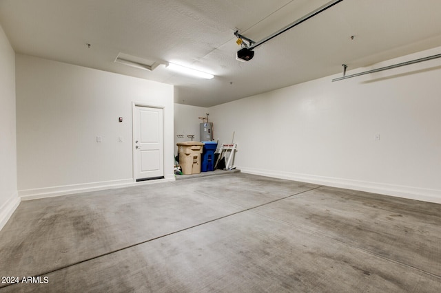 garage with a garage door opener and water heater