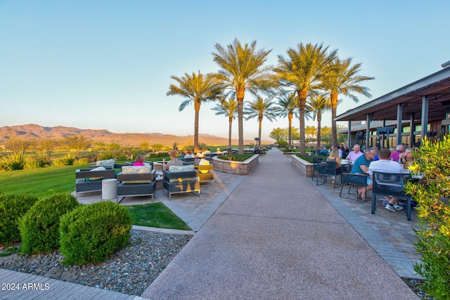 view of home's community with a patio and a mountain view