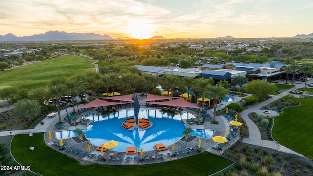 aerial view at dusk featuring a mountain view