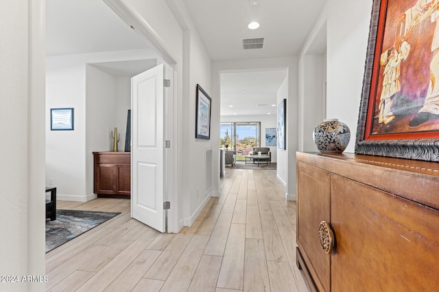 hall with light wood-type flooring