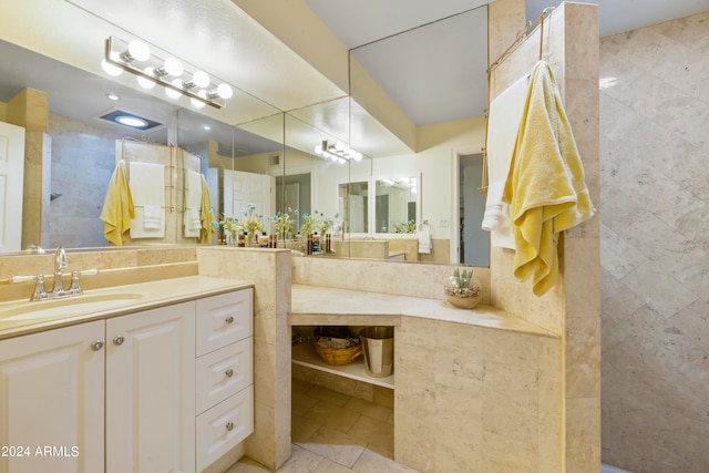 bathroom featuring vanity and tile floors