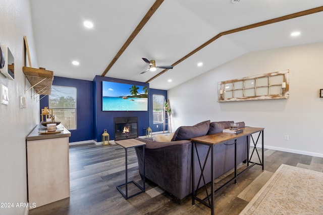 living room featuring ceiling fan, vaulted ceiling with beams, and dark wood-type flooring