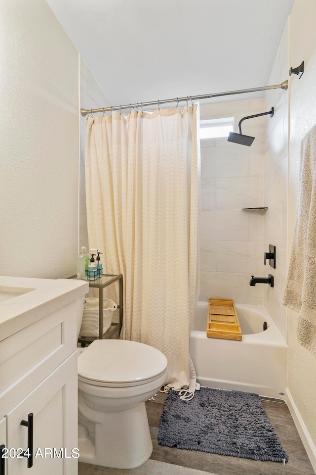 full bathroom with shower / bath combo with shower curtain, toilet, vanity, and hardwood / wood-style flooring