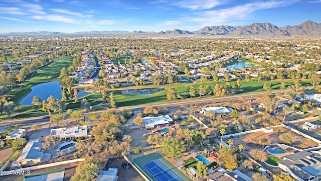 birds eye view of property featuring a water and mountain view