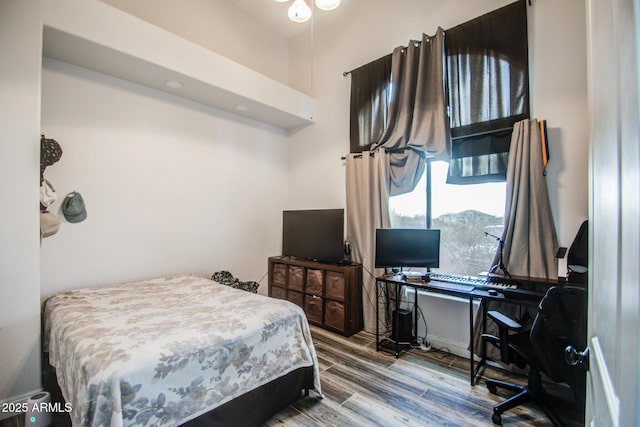 bedroom featuring wood finished floors