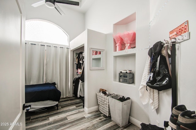 mudroom featuring baseboards, a ceiling fan, and wood finished floors