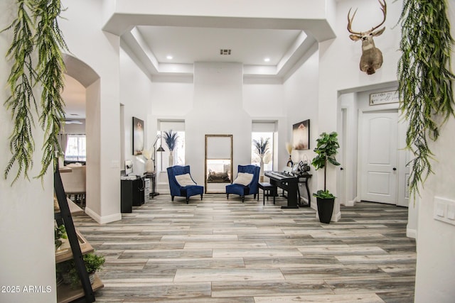 interior space with a wealth of natural light, visible vents, and light wood finished floors