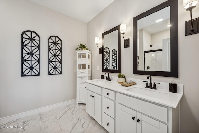 bathroom featuring a shower with door and vanity