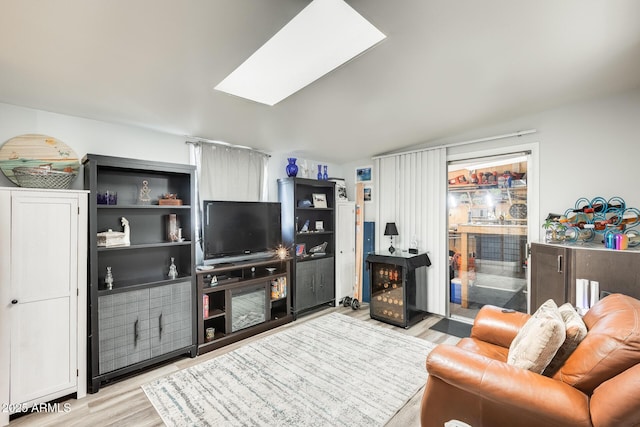 10374 W Deanne Dr, Sun City, AZ 85351 - living area featuring wood finished floors and a skylight