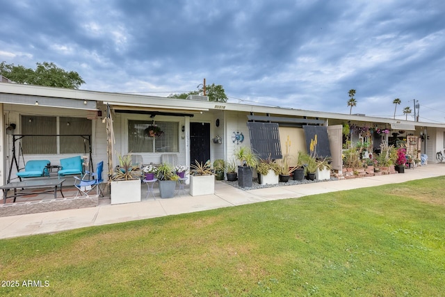 10374 W Deanne Dr, Sun City, AZ 85351 - view of front of home featuring a front lawn