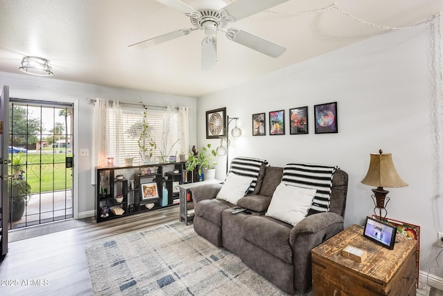 10374 W Deanne Dr, Sun City, AZ 85351 - living room with wood finished floors, baseboards, and ceiling fan