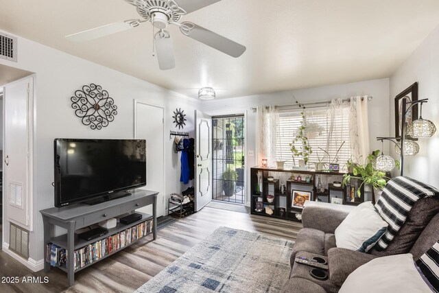 10374 W Deanne Dr, Sun City, AZ 85351 - living area with ceiling fan and wood finished floors