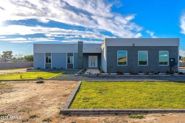 modern home with a front lawn