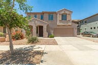 11834 N 147th Ln, Surprise, AZ 85379 - mediterranean / spanish house featuring an attached garage and driveway