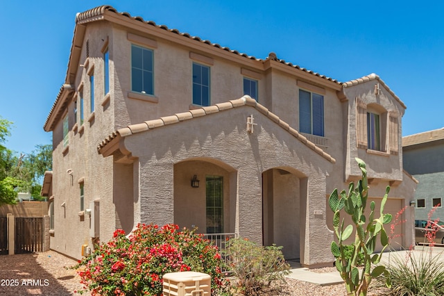 11834 N 147th Ln, Surprise, AZ 85379 - mediterranean / spanish-style home with a tile roof, stucco siding, and fence