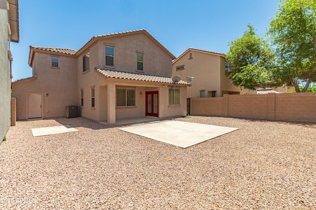11834 N 147th Ln, Surprise, AZ 85379 - back of house featuring a tile roof, stucco siding, a fenced backyard, a patio, and central air condition unit