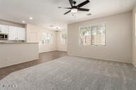 11834 N 147th Ln, Surprise, AZ 85379 - unfurnished living room featuring a ceiling fan and recessed lighting
