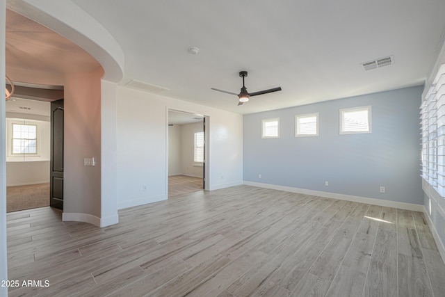 unfurnished room featuring ceiling fan and light hardwood / wood-style flooring