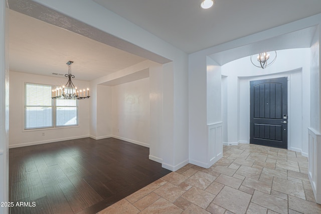 entrance foyer with a notable chandelier