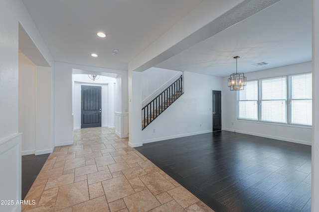 entrance foyer with a chandelier