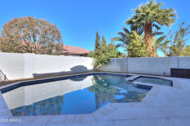 view of pool with an in ground hot tub