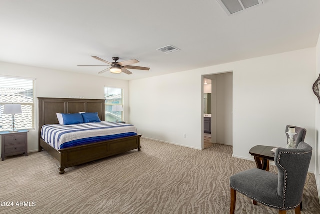 carpeted bedroom with ceiling fan and multiple windows