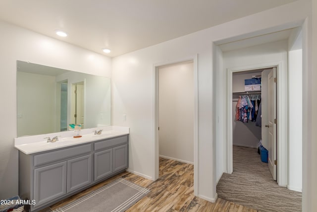 bathroom featuring vanity and hardwood / wood-style floors