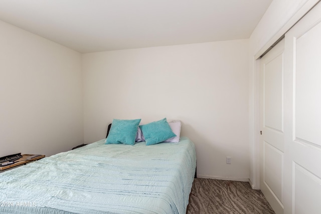 carpeted bedroom with a closet