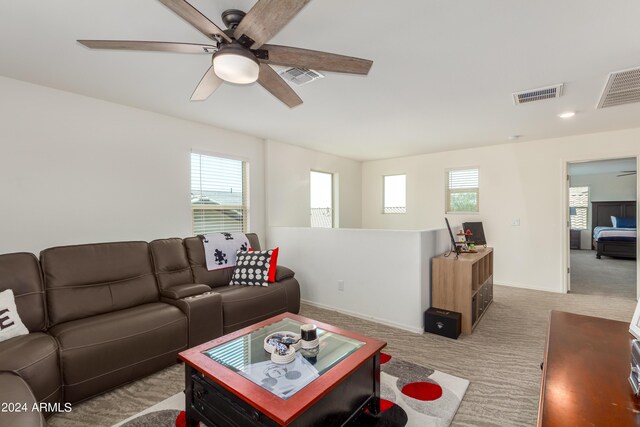 living room featuring ceiling fan and light carpet