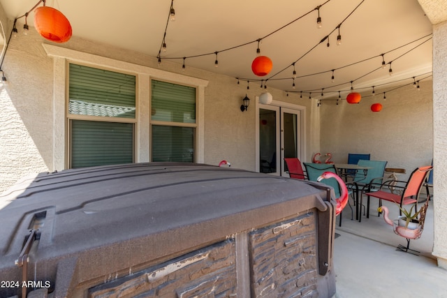 view of patio / terrace with a hot tub