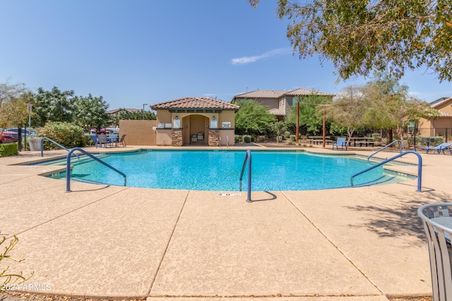 view of swimming pool featuring a patio area