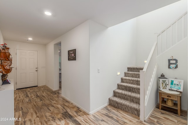 foyer entrance with hardwood / wood-style flooring