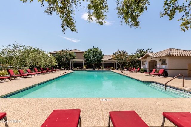 view of swimming pool with a patio area