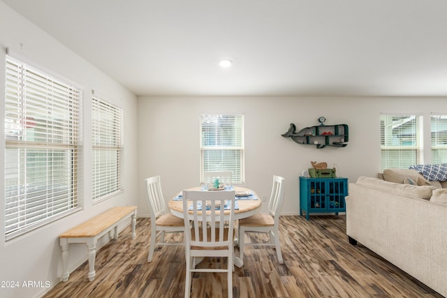 dining area with dark hardwood / wood-style floors