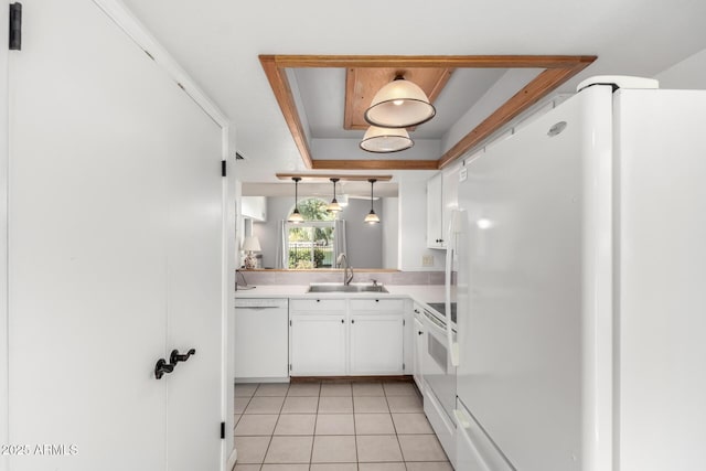 kitchen featuring a sink, decorative light fixtures, white appliances, white cabinets, and light tile patterned floors