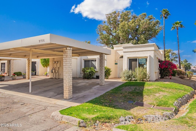 view of front of home featuring stucco siding