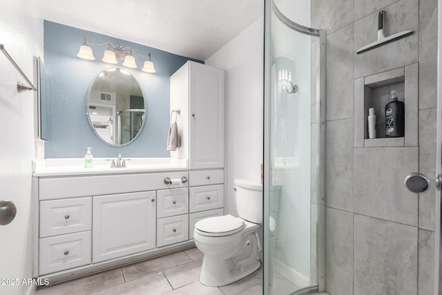 full bath with visible vents, toilet, a stall shower, tile patterned floors, and vanity