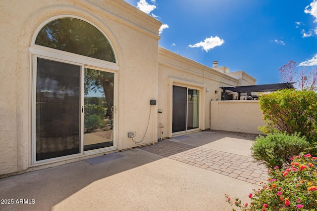 view of patio / terrace featuring fence