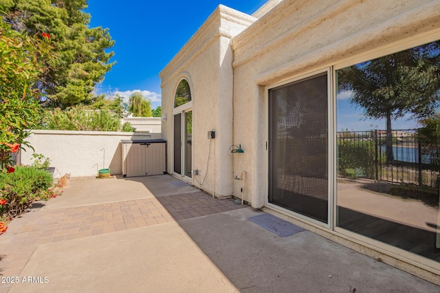 view of patio / terrace featuring fence