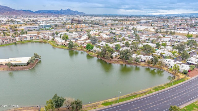 aerial view featuring a water and mountain view