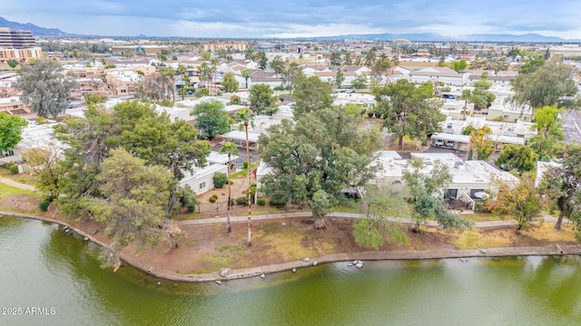 drone / aerial view featuring a residential view and a water view