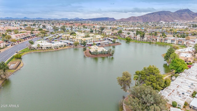 drone / aerial view with a residential view and a water and mountain view